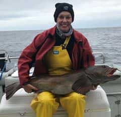 fisherwoman with lingcod